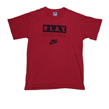 Load image into Gallery viewer, Vintage NIKE P.L.A.Y. Participate In The Lives of America's Youth Spell Out Swoosh T Shirt 80s 90s Red L