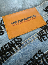 Load image into Gallery viewer, VETEMENTS All Over Print Logo Denim Jeans Light Blue Pre-Owned M
